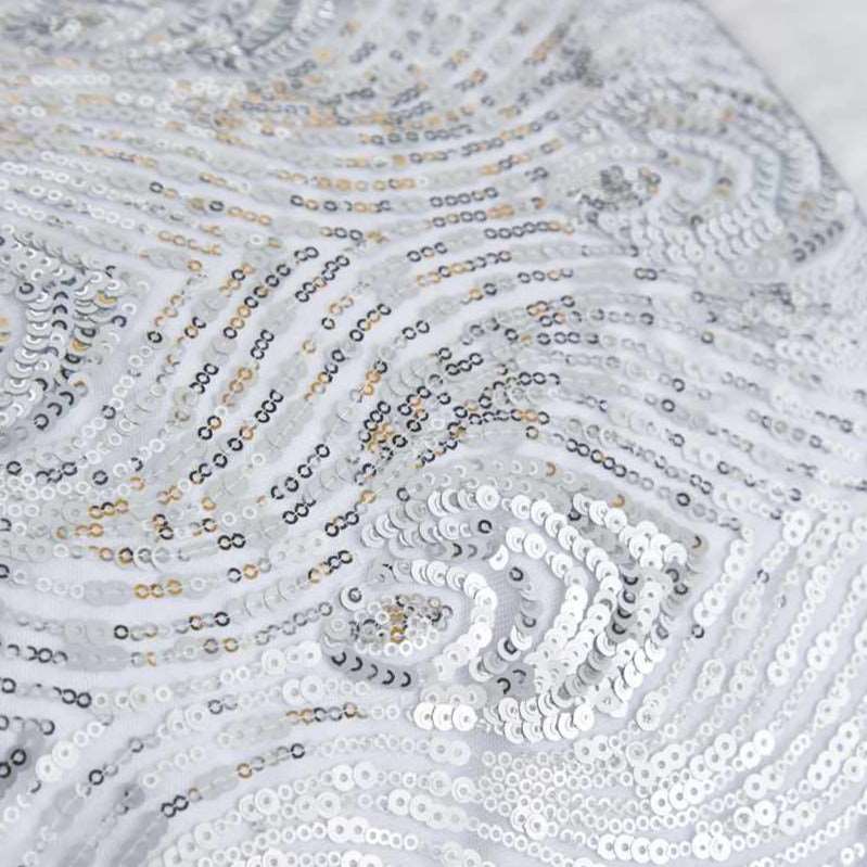 With the contemporary ‘on trend’ shades of metallic white and silver, Krista glitters in shimmering sequins in a peacock feather inspired pattern. The boudoir cushion perfectly accessorises with the bed runner and duvet cover to enhance the glamorous look.