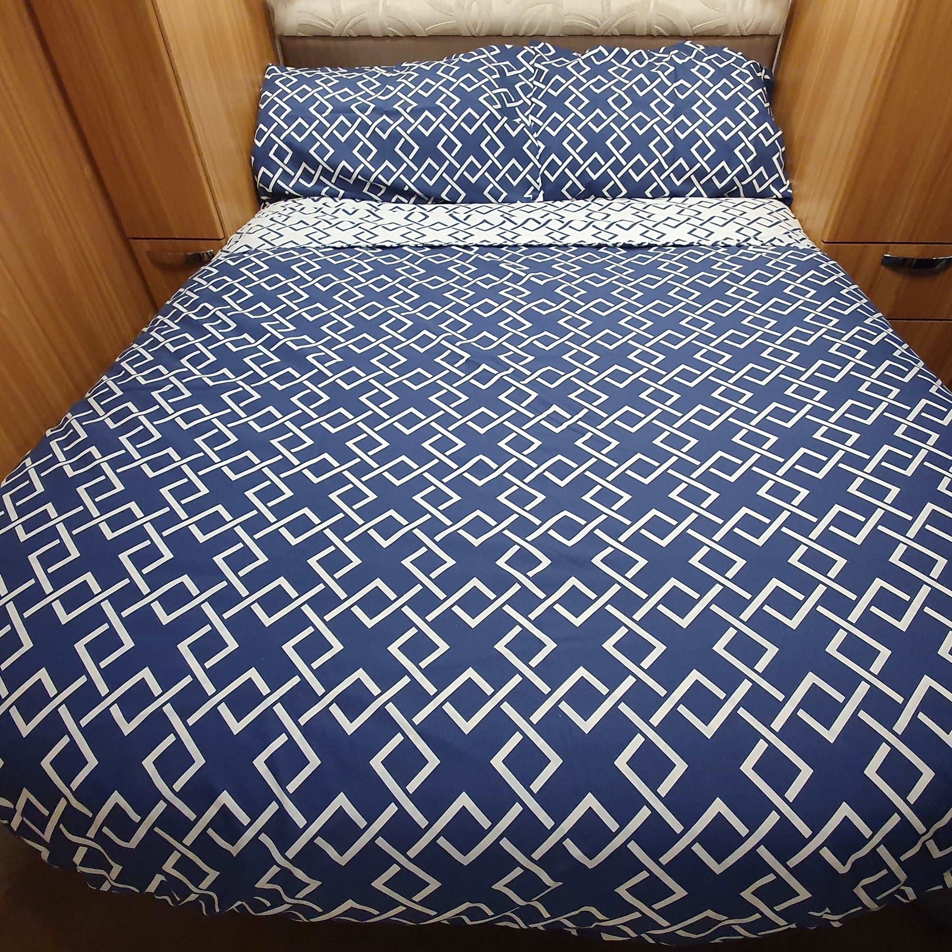 island shaped bed with atlanta navy duvet set