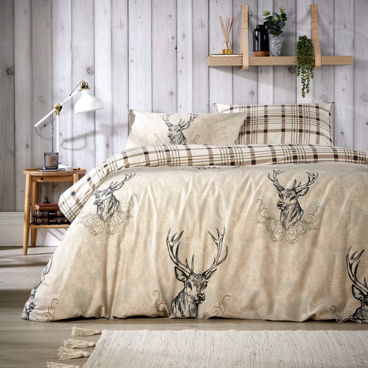 Highland Stag Duvet Set displayed on a caravan bed.